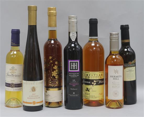 Six assorted dessert wines including two half bottles of Sauternes, 2009 and Hermits Hill, 2008 and a Malmsey Madeira 15 years old.